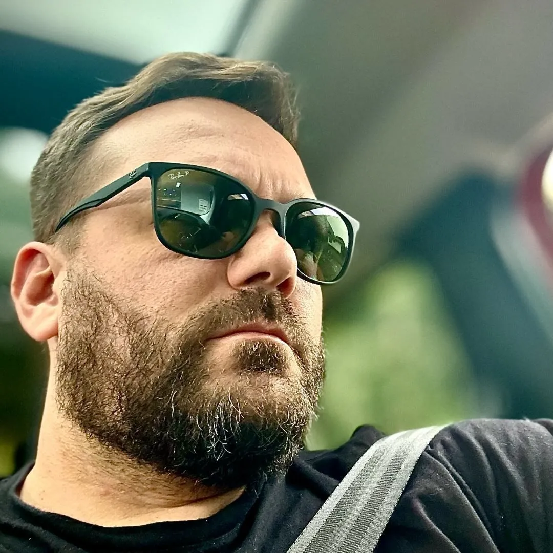 Male customer wearing sunglasses featured in a Soda Peak review testimonial